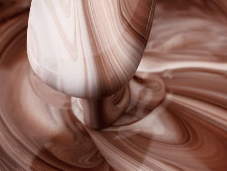 Abstract background, hot, melted chocolate and milk mixing patternの写真素材