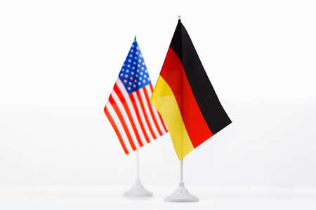 USA and Germany small flag on white background close-upの写真素材