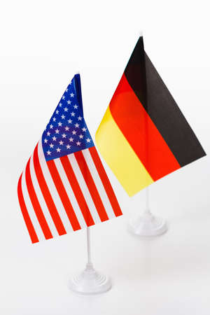 USA and Germany small flag on white background close-upの写真素材