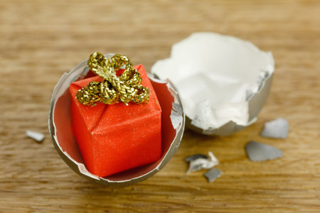 Gift box surprise concept, open egg shells as traditional symbol of born
