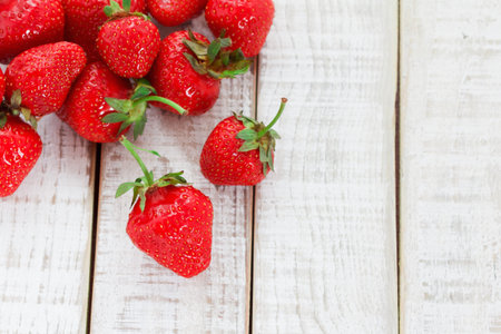 Ripe Strawberry on wooden table. View from above with copy spaceの写真素材