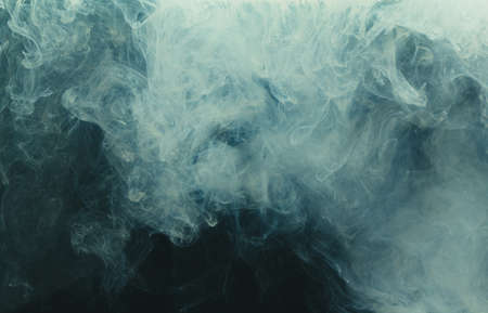 Acrylic ink colors as smoke in water. Abstract background.の写真素材