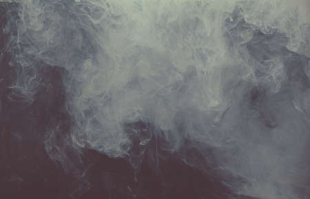 Acrylic ink colors as smoke in water. Abstract background.の写真素材