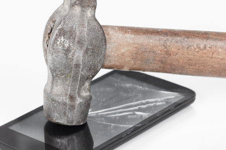 Crack glass display of the smartphone or a tablet, the result of falling, hitting or damaging the hammer.の写真素材