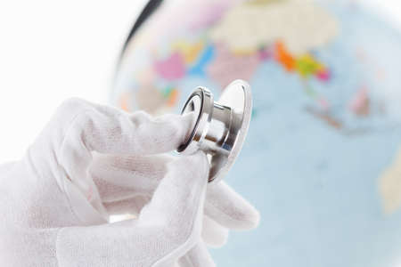 Stethoscope and Earth as symbol of care for environment. Map globe.の写真素材
