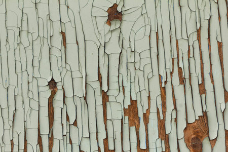 Background of old board with peeling cracked paint