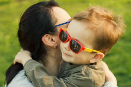 Family having fun mother son happy summer glasses.の写真素材