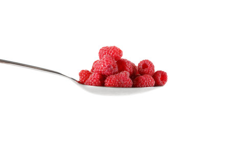 Raspberry in stainless steel spoon isolated against white