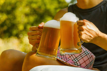 Man clink beer woman nature fun octoberfest.の写真素材