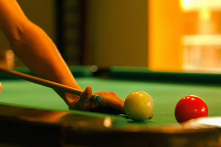Playing man by cue in billiard pool activity background close-up.