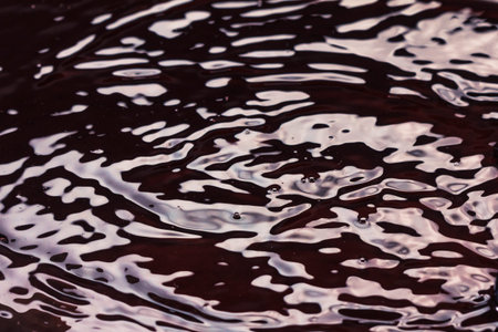 Red juice or wine splash grape berry closeup, macro.