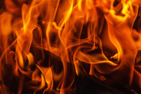 Glowing hot charcoal briquettes close-up background texture. bonfire coals