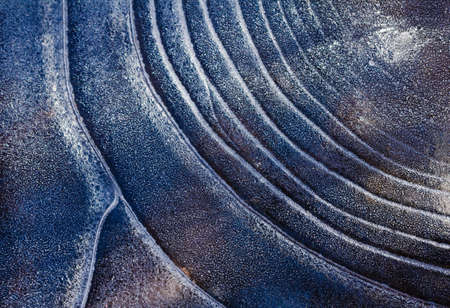 Ice pattern background on the surface of the pond or river. Macro frost crystal winter designの写真素材
