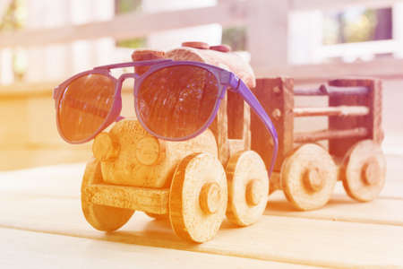 Old vintage wooden toy train on wooden backgroundの写真素材