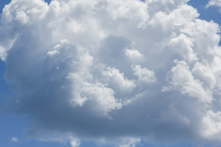 Blue sky with clouds and sun white.