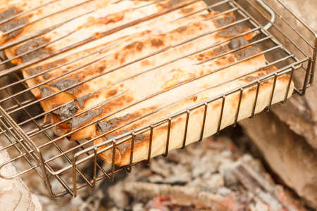 Shawarma chicken roll in a pita with fresh vegetables grilledの写真素材