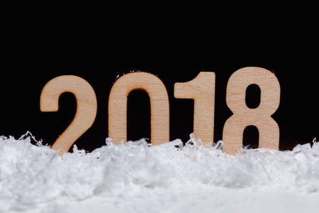 Christmas New year 2018 made with wooden on black background, copy space.