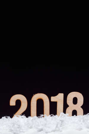 Christmas New year 2018 made with wooden on black background, copy space.の写真素材