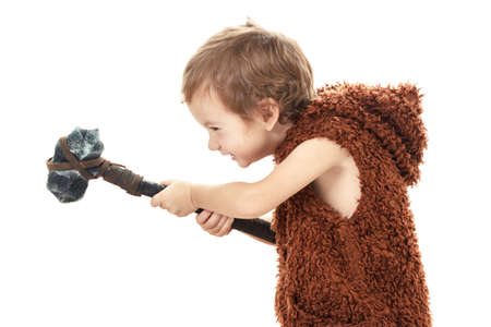Cute cheerful naughty child playing with axe. Humorous concept ancient caveman isolated on white backgroundの写真素材
