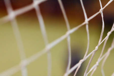 View through the net grid. Football field and gatesの写真素材