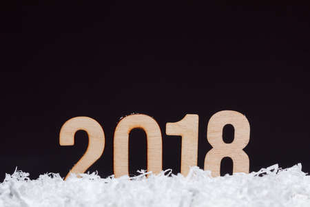 Christmas New year 2018 made with wooden on black background, copy space.の写真素材