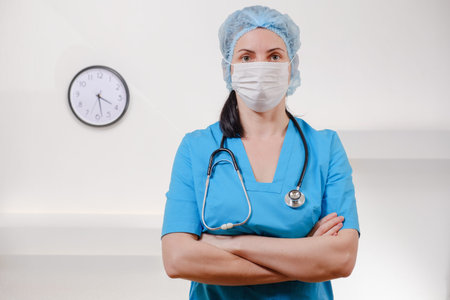 Medical doctor with stethoscope on white background. Female nurse wearing surgical mask and hat....