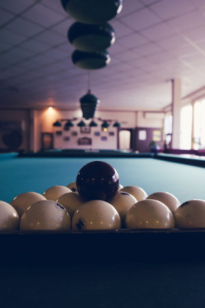 Playing billiard. Billiards balls green billiards table. Billiard sport concept. Pool billiard game.