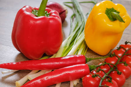 Ingredients vegetables for Burritos, tomatoes and peppers on wooden background. Top view. close upの写真素材