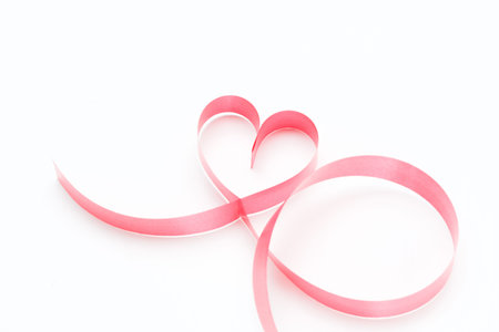 Ribbons shaped as hearts on white, valentines day concept card