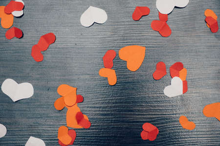 Valentine's Day background with hearts on wood abstract backdrop.の写真素材