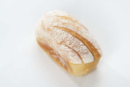 Freshly baked bread isolated on white background, top view