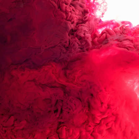 Acrylic colors and ink in water isolated on white background. Colorful Paint splash. Red Abstract backgroundの写真素材