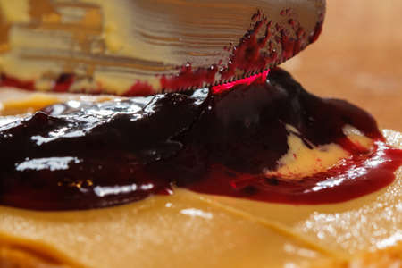 peanut butter sandwich and peanuts with jam macro. Kitchen knife.の写真素材