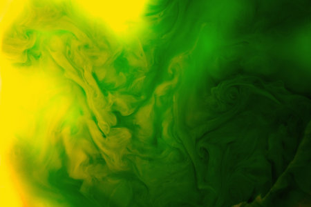 Color Liquid in dynamic flow forming interesting and unique shapes and bubbles. Colorful yellow...