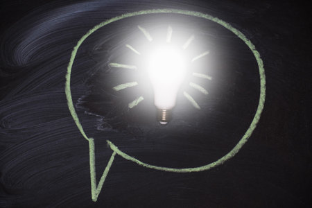 Chalkboard with idea lamp background. Light bulb as symbol of successful business idea. Business...