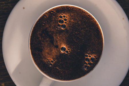 Coffee white cup with foam. Overhead top view