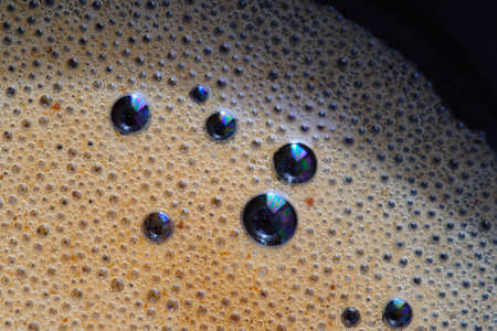 Macro of aroma coffee foam bubble backgroundの写真素材