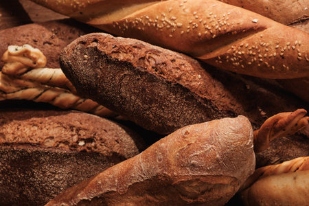 Group of Fresh fragrant bread on the table. Food concept Wheat pastryの写真素材
