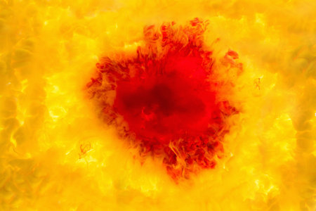 ink in the water. A splash of red yellow paint. Abstract background colorの写真素材