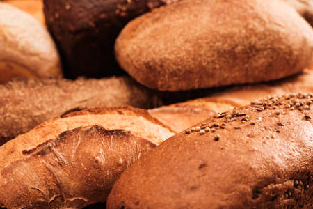 Fresh fragrant bread on the table. Food concept Wheat pastryの写真素材