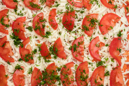 Pizza background. Close-up of cheese and tomato. Home-made Italian comfort food with vivid colors and textured aesthetic pattern.の写真素材