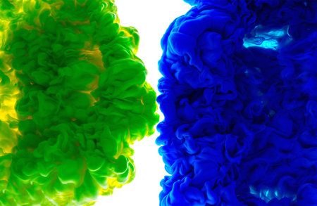 Color drop in water, photographed in motion. Abstract swirling. Cloud of silky bulb under water isolated on white background. Colorful green and blue paint splash droplet.の写真素材