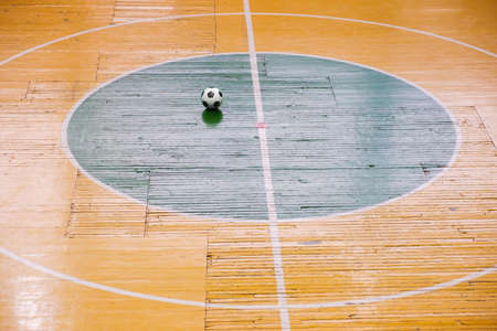 Indoor football or futsal stadium with a bright markup of the playing field and ball in center. Soccer playground. Top View.の写真素材