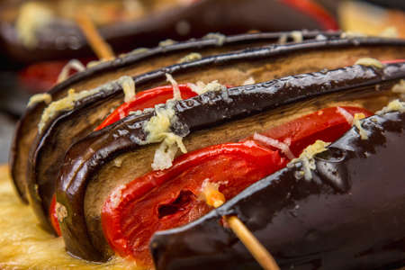 Courgettes stuffed with cheese, tomatoes and bell pepperの写真素材