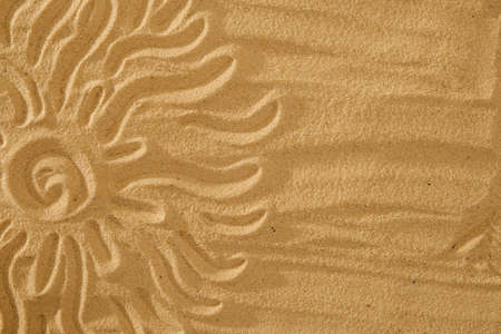 Sun on sand on beach holiday background sign conceptの写真素材