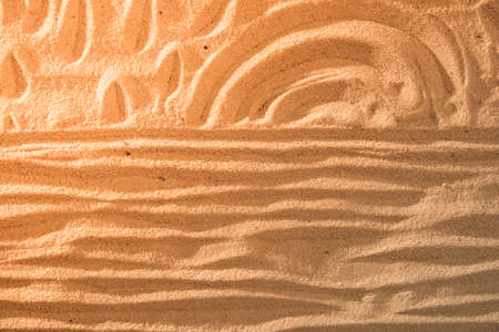 Sun and ocean on sand on beach holiday background sign conceptの写真素材