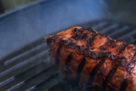 Beef steak fried in a frying pan grill closeup foodの写真素材