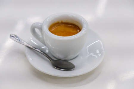 Delicious cup of coffee over white backgroundの写真素材