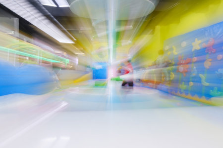 Blur image of playground in the mall, use for background.