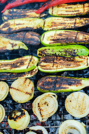 Grilled vegetables in a herb marinade on a grill pan, top viewの写真素材